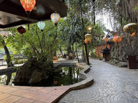 Peaceful illuminated garden path traditional lanterns