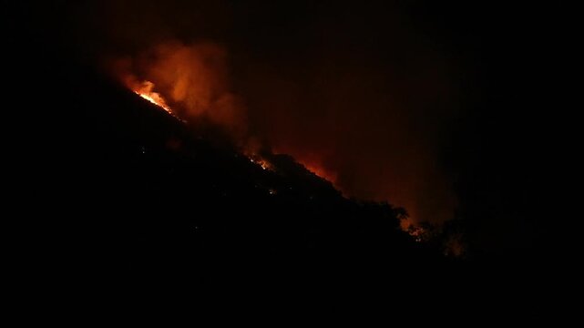 The Mountain Road wildfire burns on the flank of Lewis Peak in Ogden, Utah on 11 July, 2026