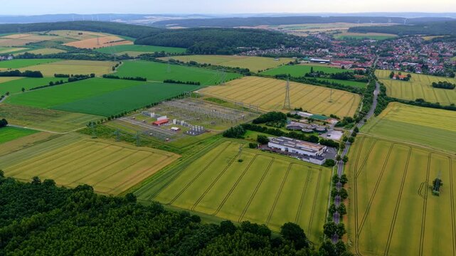 Aerial Video of Electrical Substation Across Rural Farmland