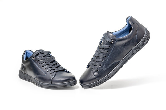 Black leather sneakers. Sport shoes isolated on white background, clipping path included