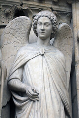Fototapeta premium Angel, Notre-Dame cathedral, portal of the Virgin, Paris