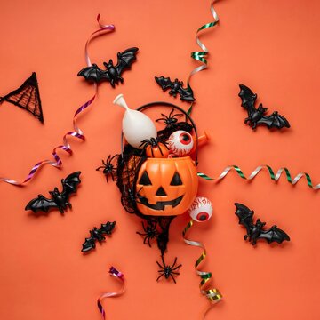 Spooky halloween decorations flat lay bats eyeballs and jack o' lantern for festive october celebrations