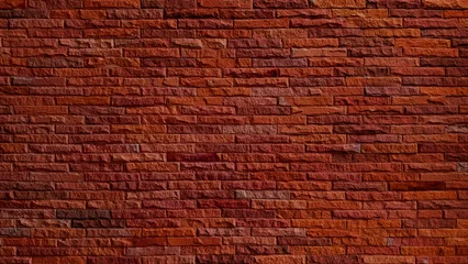 Red Brick Wall Background with Textured Stone Cladding, Rustic Terracotta Split Face Tiles, and Horizontal Slate Masonry for Industrial Interior Design and Modern Outdoor Facade. © WONGSAKORN