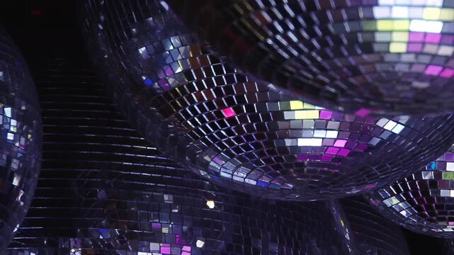 Experience the magical ambiance of a birthday bash under radiant disco lights. Shimmering reflections dance across the energetic club, perfect for a vibrant night celebration.