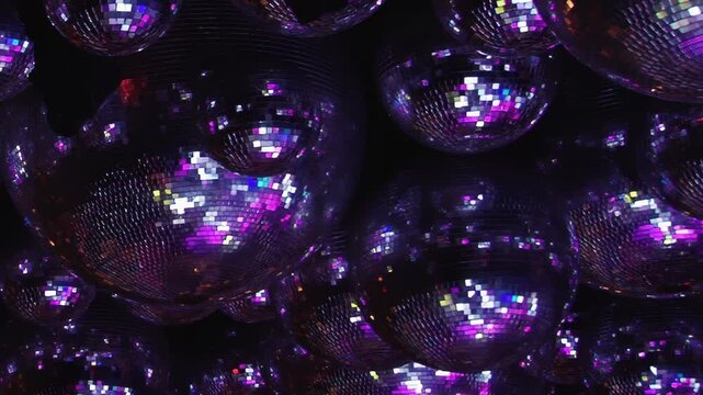 The dazzling atmosphere of a birthday bash at the disco. Hundreds of mirrored balls reflect a kaleidoscope of colors, creating a spectacular light show for guests dancing into the evening.