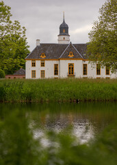 Fototapeta premium Romantic view at the backside of noble house Fraeylemaborg at summer