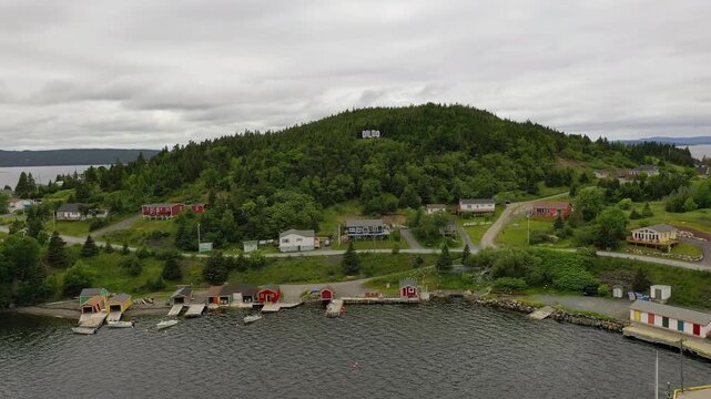 Aerial View of Dildo Hill Sign and Coastal Village Newfoundland Canada