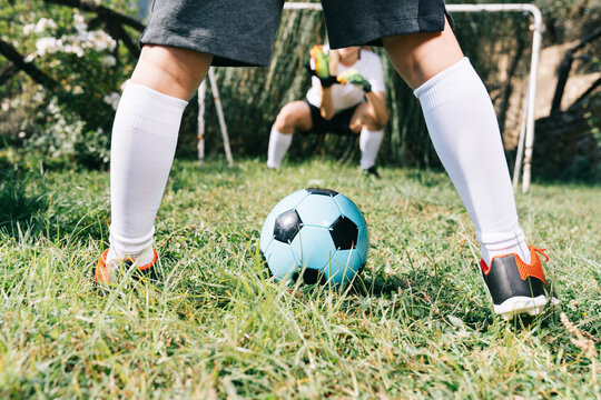 Two soccer players train on the sports field