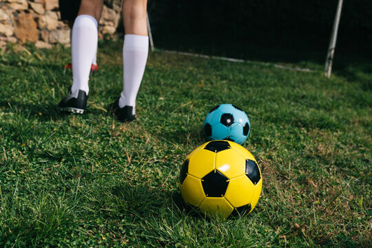 Soccer player trains on the sports field