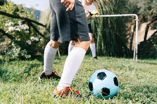 Two soccer players train on the sports field