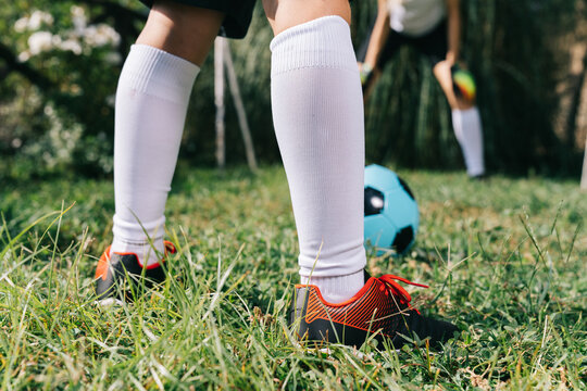 Two soccer players train on the sports field