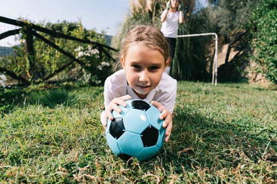 Girl holding soccer ball