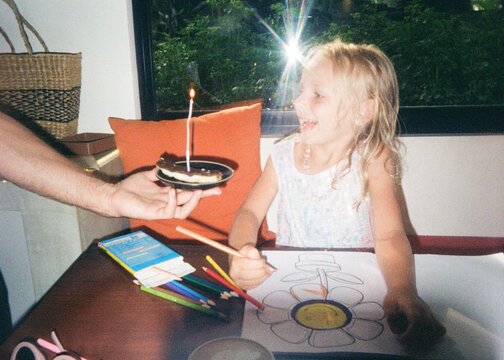 Child Enjoying Birthday Surprise