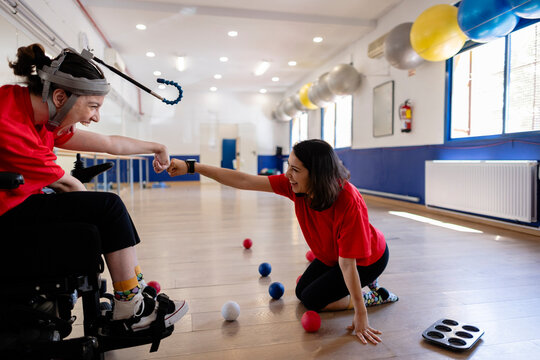 Women celebrating success playing adaptive boccia sport