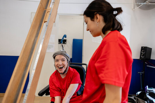 Disabled woman smiling during rehabilitation therapy session