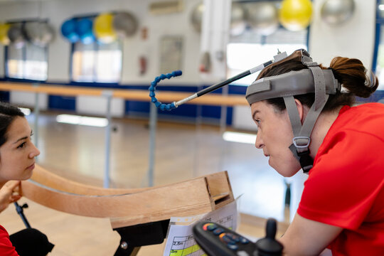 Woman with assistive technology equipment participating