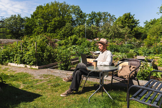 Remote Working on Laptop in Community Garden