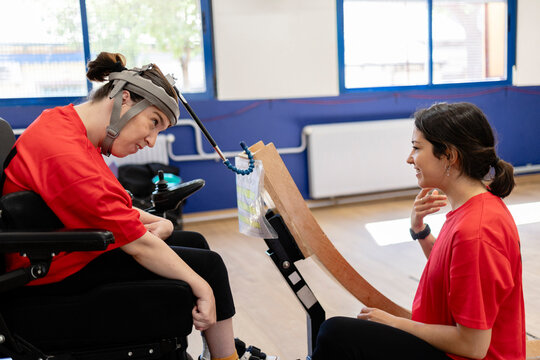 Woman with disability interacting with therapist using