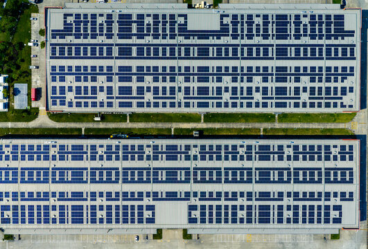solar panels covering factory rooftop