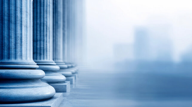 Long row of ancient stone columns under soft blue sky