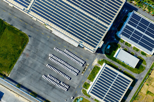 solar rooftop factory with parked cargo trailers