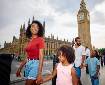 Family of four enjoys a walk near Big Ben