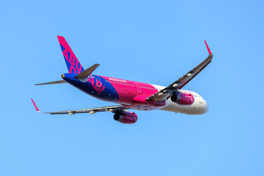 Luqa, Malta - July 16, 2026: Wizz Air Malta Airbus A321-231 (REG: 9H-WZB) with the Abu Dhabi tail fin departing runway 13.