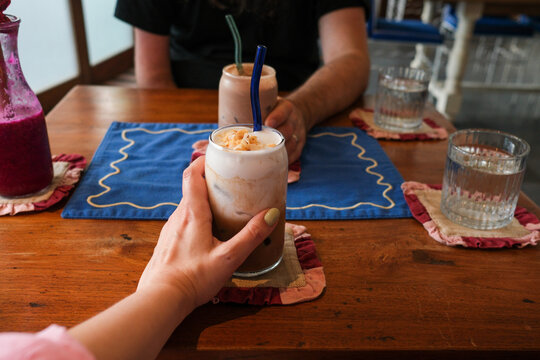 Hand Holding Iced Coffee