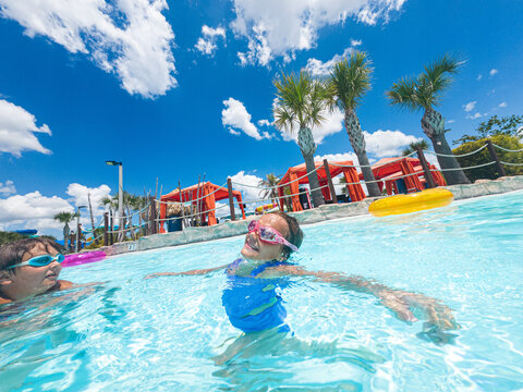 Happy kids in swimming pool
