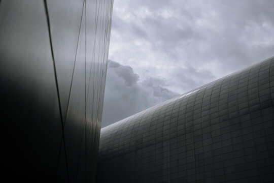 Pre-Storm Clouds Enclosed by Sci-Fi Metallic Walls.