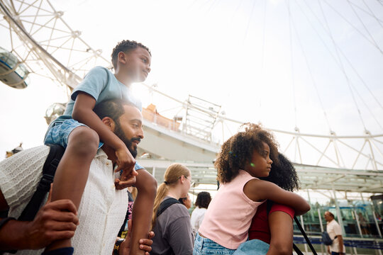 Family Enjoys a Day out at the Amusement Park
