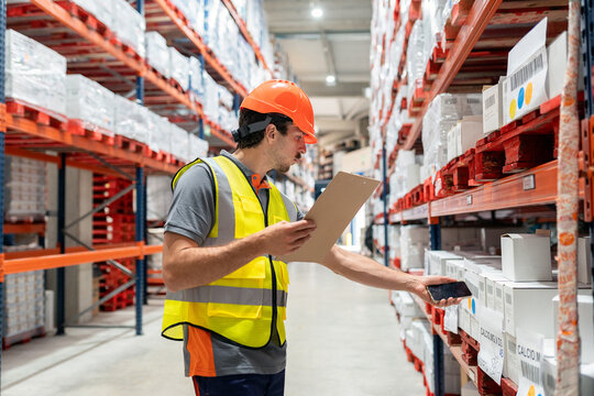 Warehouse worker scanning inventory using smartphone