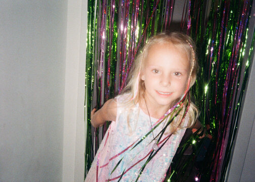 Happy Birthday Girl Among Colorful Party Streamers