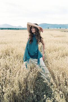 Woman posing in wheat field 