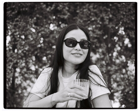 Woman with glass outdoors