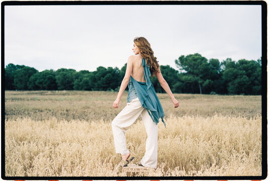Woman on stool on field