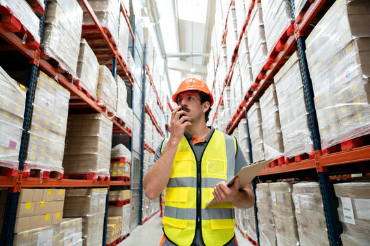 Warehouse worker communicating using radio for inventory logistics