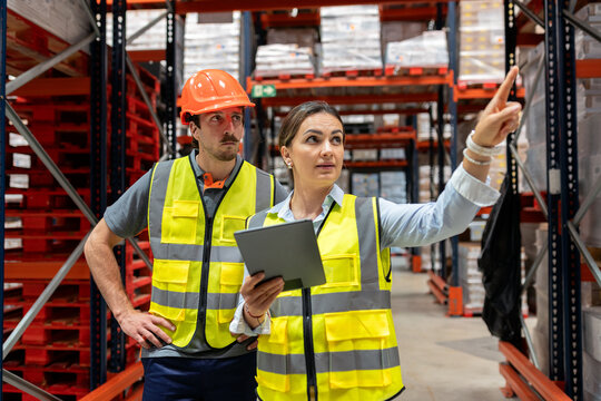 Warehouse workers managing inventory and logistic operations