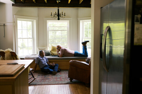 married lgbtq couple lounging in their living room and relaxing