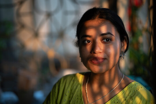 Portrait of Young Indian woman with evening sunlight fall on face