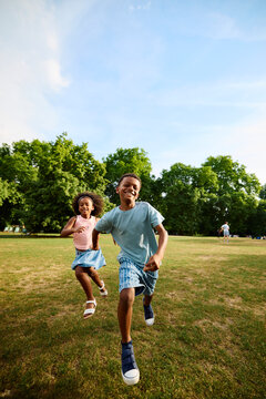 Children run in a park