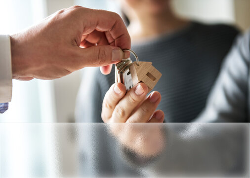 Handing over house keys to new homeowner