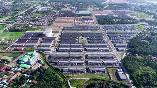 Aerial view shows large housing complex with uniform rows and grid streets at Kubang Semang