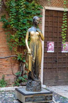 Verona Italy - September 1 2025: The Statue of Juliette in Verona Italy With Ivy Growing on the Walls
