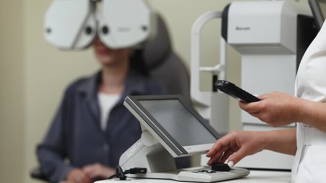 Patient undergoing a phoropter vision examination in a modern eye clinic. Concept ophthalmology, vision diagnostics, eye examination, healthcare, preventive medicine.