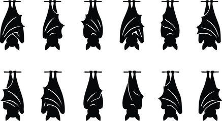 Twelve black silhouettes of bats hanging upside down from a branch isolated on a white background, for halloween © GFX