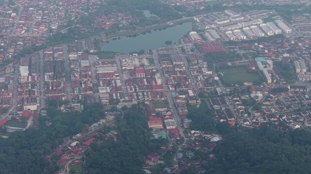 Aerial view captures a vibrant town with red roofed buildings at Kampar