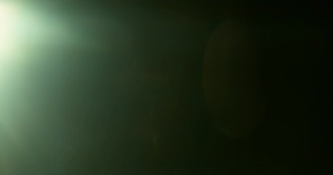 Slow motion cinematic lens flare and light leak effect isolated on black background. Perfect overlay for VFX, transitions, title reveals, film burn style and glow highlights.