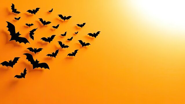 Halloween bats flying in orange background for spooky decorations and party themes