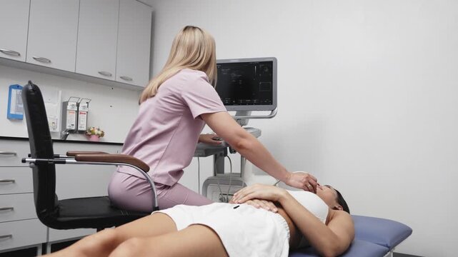 Young woman undergoing a thyroid ultrasound examination in a modern medical clinic. Concept thyroid health, endocrinology, ultrasound diagnostics, preventive medicine, medical examination.